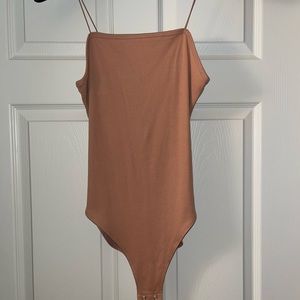 Tan body suit